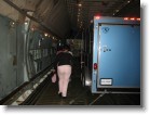 Here we are walking through the cargo area (and yes, that's a truck with a trailer attached just chilling in the belly of the plane).