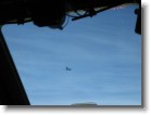 The KC-10 flying away from our C-5.