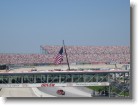 American flag raised during the National Anthem.