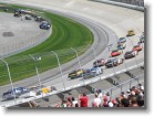 The cars rounding turn 3.