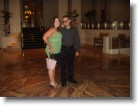 Blurry Ashley & Juston standing on the Circle of Life tile mosaic in the lobby of the Waldorf Astoria.