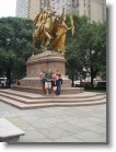 Wendy, Juston, Ashley, & Lesley in front of a statue at the entrance of Central Park.