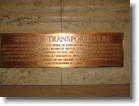 Plaque describing the Spirit of Transportation sculpture.