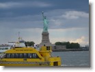 Water taxi in front of the Statue of Liberty.