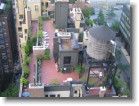 Looking down at a rooftop garden terrace.