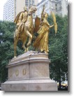 The statue at the entrance to Central Park.