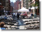 An opera singer on the street in Little Italy.