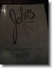 The menu at John's Pizzeria.