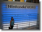 Ashley in front of the Nintendo World sign.