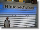 Juston in front of the Nintendo World sign.