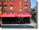 Looking across the street at Lombardi's Pizza, the first pizzeria in America.