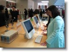 Ashley playing on the computers in the Apple Store.