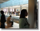 Ashley perusing the products on the second level of the Apple Store.