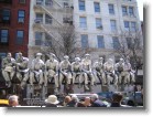 Silver faux construction worker statues on a truck in SoHo.