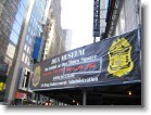 A banner in Times Square advertising the DEA Museum.
