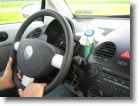 The dashboard in the Beetle, complete with VW plush flower in the vase.