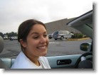 Ashley smiling as we enter a parking lot.